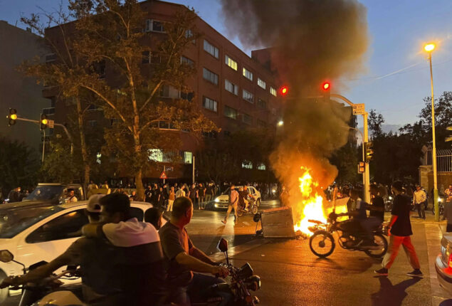 Iran hangs its first mass protester