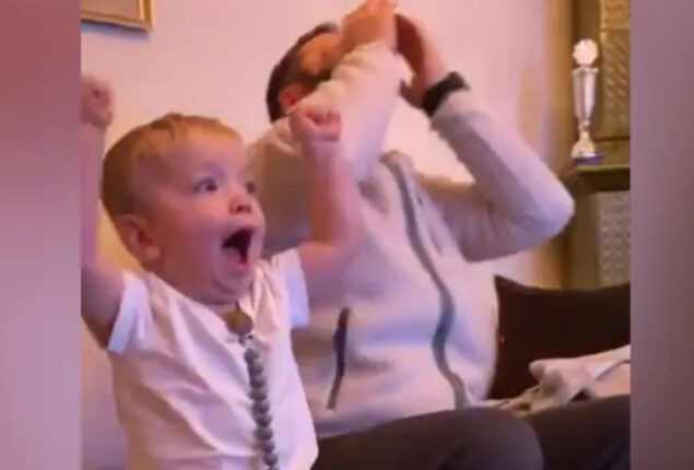 Kid acts like his dad while watching a football match, his cute: Viral