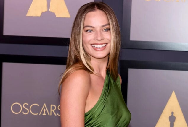 Margot Robbie discusses how she improvised a scene with Brad Pitt for Babylon