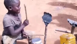 Young boy plays drums made of wooden sticks & empty container: viral video
