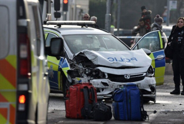 Police car heading way to crash hits another automobile