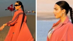 Georgina Rodriguez enjoys in desert while wearing orange sports coat