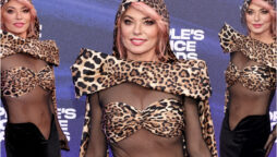 Shania Twain attended the people's choice awards in a transparent leopard dress
