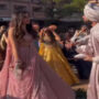 Groom turns performer for bride by singing and dancing to a song
