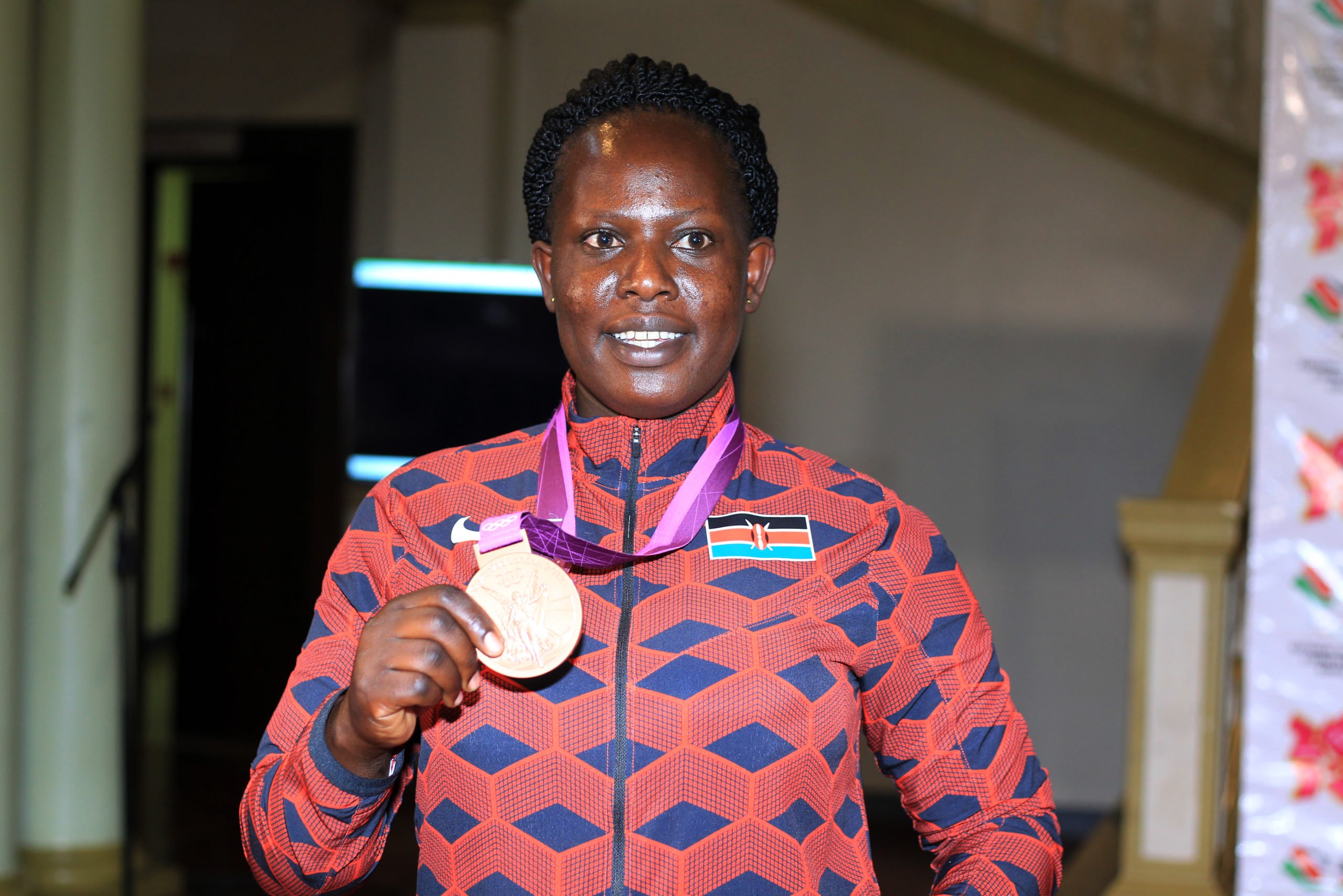 Kenya's Jelimo receives her bronze medal from London 2012 Olympics