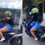 Disaster strikes: Girl rides a heavy motorbike while shaking it for fun