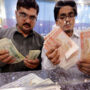 Rupee remains largely stable