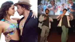 Men dance to Besharam Rang in the theatre, audience applauds