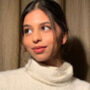 Suhana Khan takes photographs with her admirers at Mumbai airport