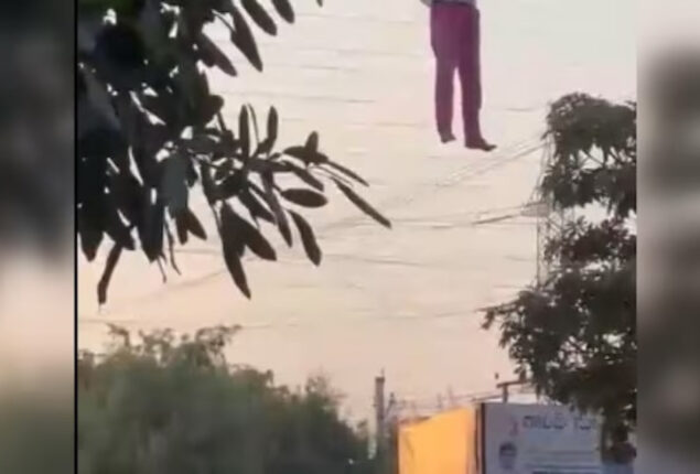 A drunk man hanging from a Telangana billboard goes viral