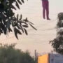 A drunk man hanging from a Telangana billboard goes viral