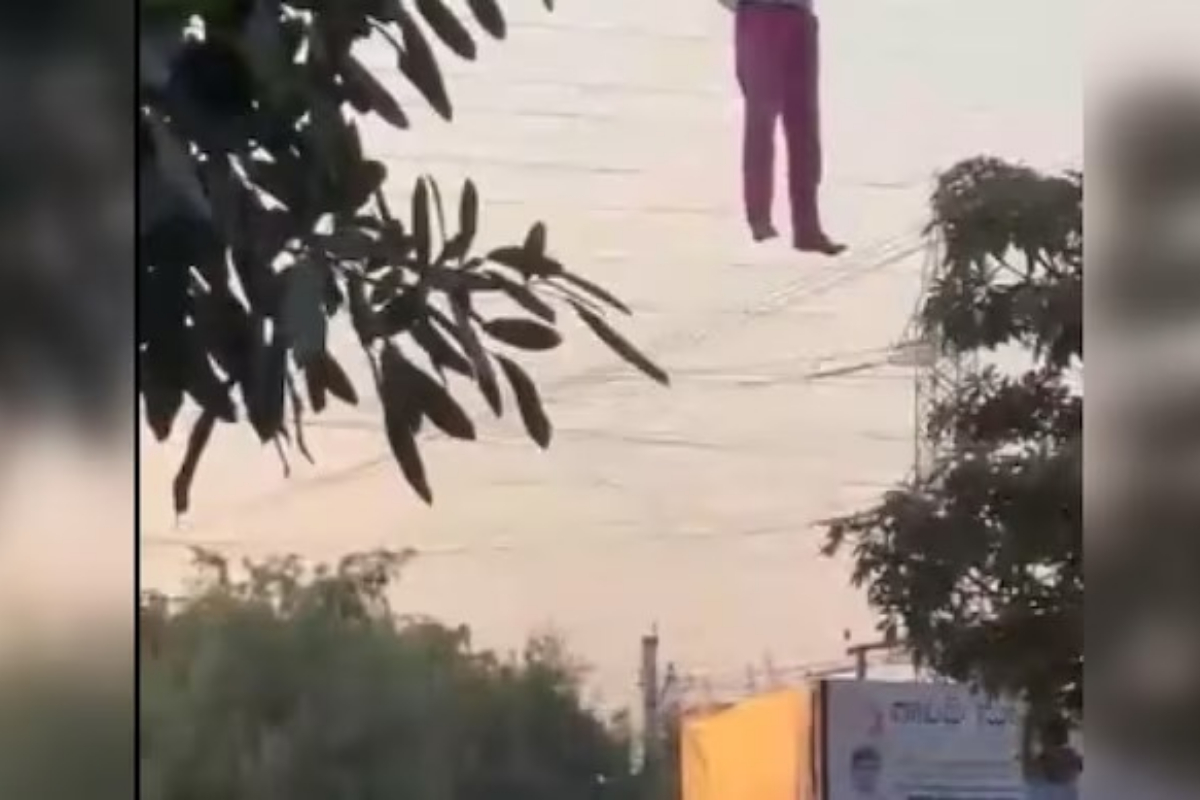 A drunk man hanging from a Telangana billboard gone viral