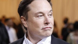 Elon Musk gives a hug to a YouTuber