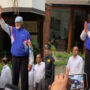 Amitabh Bachchan waves at fans while embracing them at Jalsa