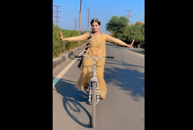 Girl ride bicycle while dancing on song by Alka Yagnik, Kumar Sanu