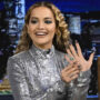 Rita Ora shows her sparkling emerald and gold wedding ring