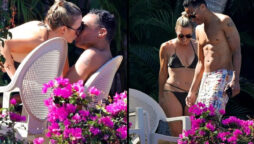 Amy Robach and T.J. Holmes poolside kiss on their Mexico vacation