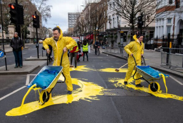 Activists creates large Ukraine flag outside Russian embassy