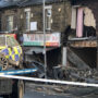 Bradford police car crash causes damage to buildings