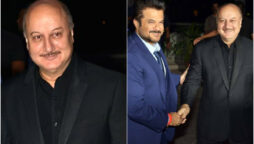 Anupam Kher hugs Anil Kapoor at an event