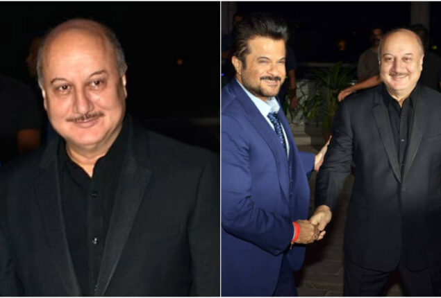 Anupam Kher hugs Anil Kapoor at an event