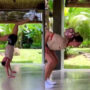 Girl’s skills to balance and control a football while doing acrobats