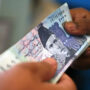 Rupee eases against dollar on shrinking forex reserves