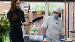 Kate Middleton struggles to make a pancake during visit