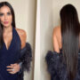Demi Moore wears a feather jacket with a vintage blue halter gown