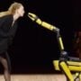 Robots walk the ramp with models at Paris Fashion Week