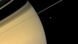 NASA's Breathtaking Capture: Saturn and its Moon in a Stunning Image