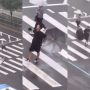 Heartfelt Rain Dance: Man Crosses Road with Joy