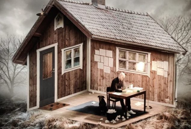 Can you determine if this man is sitting inside the home or outside?