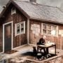 Can you determine if this man is sitting inside the home or outside?