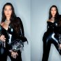 Nora Fatehi dazzles with a glamorous twirl in a black latex pantsuit