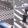 Man finds joy in the rain, dances his way across the road
