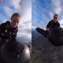 Skydiver Performs Mid-Air Jump on Another in Thrilling Stunt
