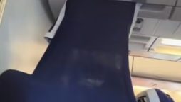Passenger creates DIY VIP section in economy class with blanket