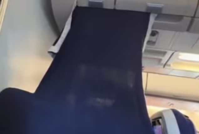 Passenger creates DIY VIP section in economy class with blanket