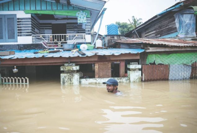 Myanmar Floods: Baby Rests Amid Evacuations and Relief