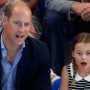 Prince William using Princess Charlotte as shield