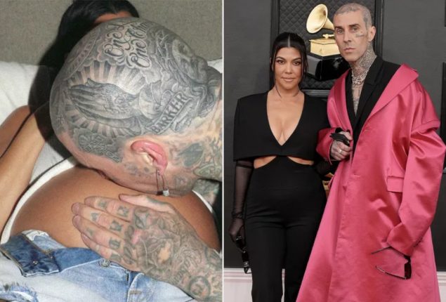 Travis Barker sweetly kisses Kourtney Kardashian’s baby bump
