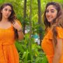 Ashnoor Kaur looks radiant in a tangerine jumpsuit in a sunkissed picture