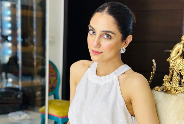 Maya Ali dazzles in an elegant white halter neck top