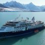Folks learn towel origami on stranded Ocean Explorer cruise liner