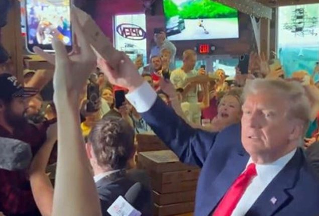 Donald Trump Serves Up Pizza and Politics in Iowa Pub