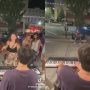 Woman ruins the busker’s piano and interrupts his performance