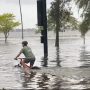 Florida Man Cycles Through Flooded Street in Viral Video