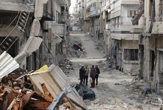 Syria war: Drone strike kills 60 at military academy