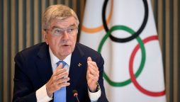 IOC members from Russia avoid suspension despite military links, says Bach